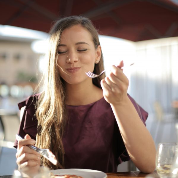 woman enjoying her food